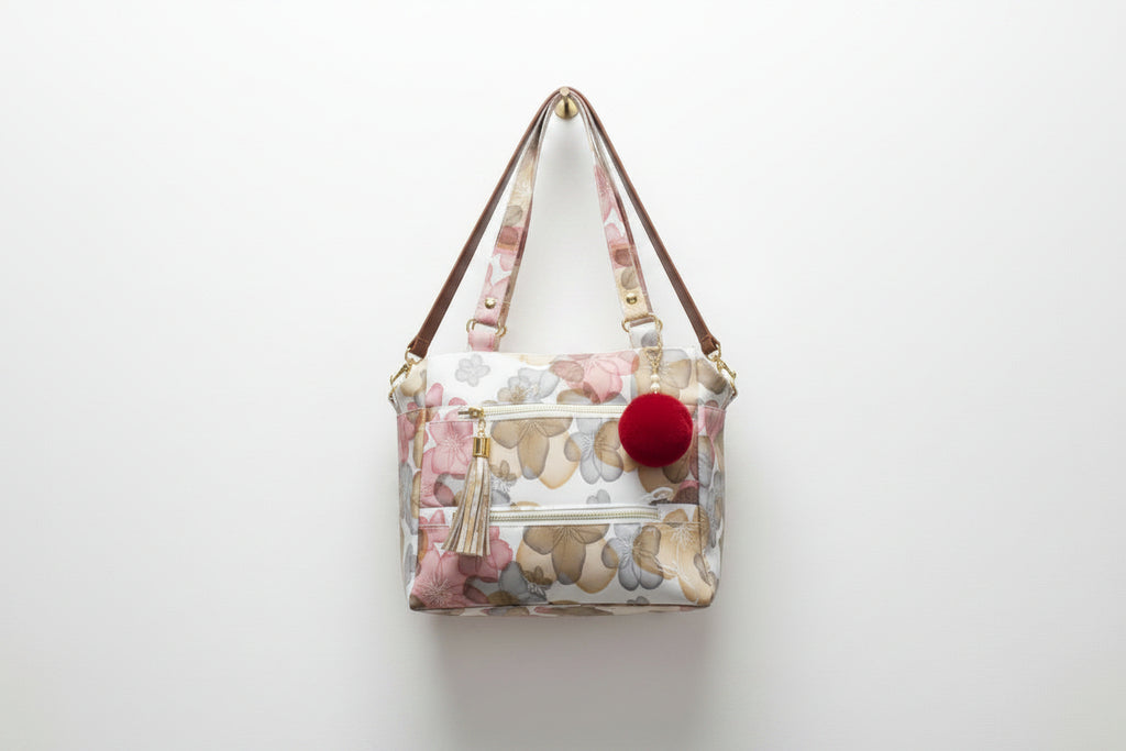 Floral print hand with sling bag