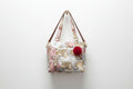 Floral print hand with sling bag