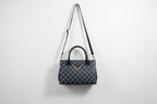 Designer check print sling Bag