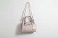 Textured hand with sling bag